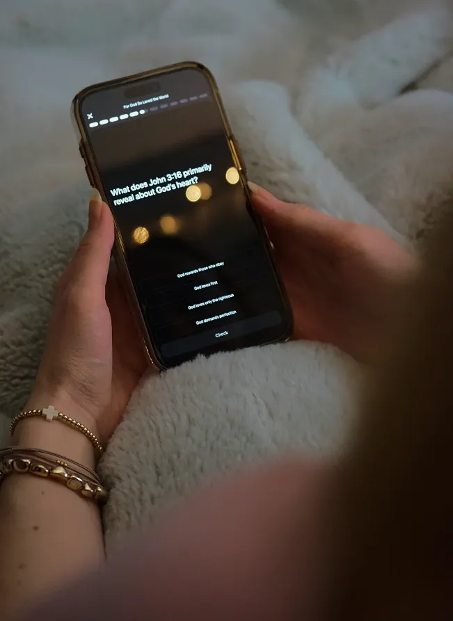 Person doing daily Bible study in bed